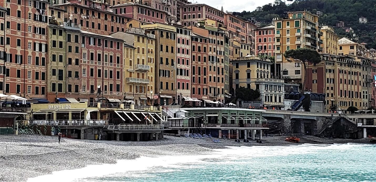 A picture containing building, water, outdoor, riverDescription automatically generated