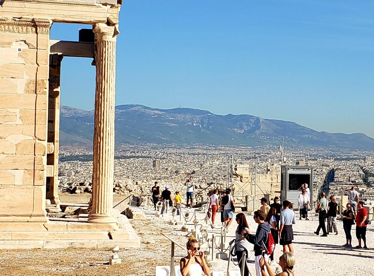 A picture containing outdoor, sky, mountain, peopleDescription automatically generated