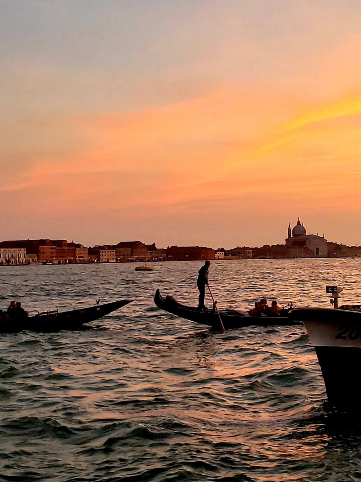 A group of people rowing a boatDescription automatically generated with low confidence