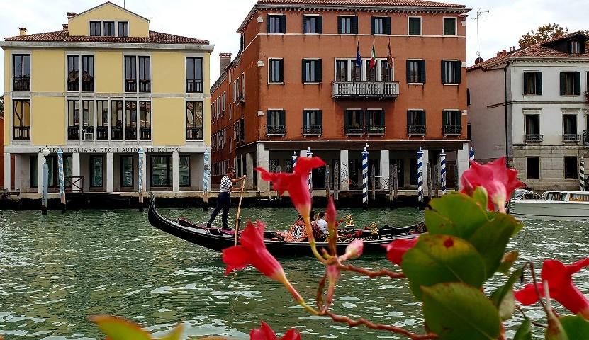 A picture containing building, water, outdoor, boatDescription automatically generated